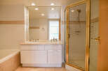Step into a luxurious bathroom featuring a double vanity with ample counter space.
