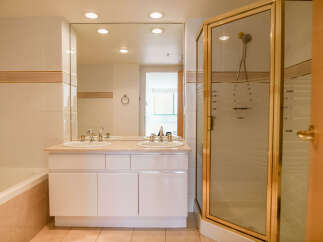 Step into a luxurious bathroom featuring a double vanity with ample counter space.