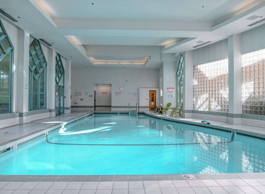 This stunning indoor pool offers a serene and inviting atmosphere, perfect for relaxation and exercise.