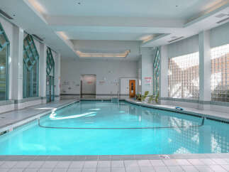 This stunning indoor pool offers a serene and inviting atmosphere, perfect for relaxation and exercise.