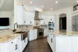 This stunning kitchen boasts a bright and airy design, perfect for culinary enthusiasts.