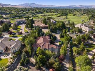 Discover luxury living in this stunning estate, nestled amidst lush greenery and overlooking a scenic golf course.