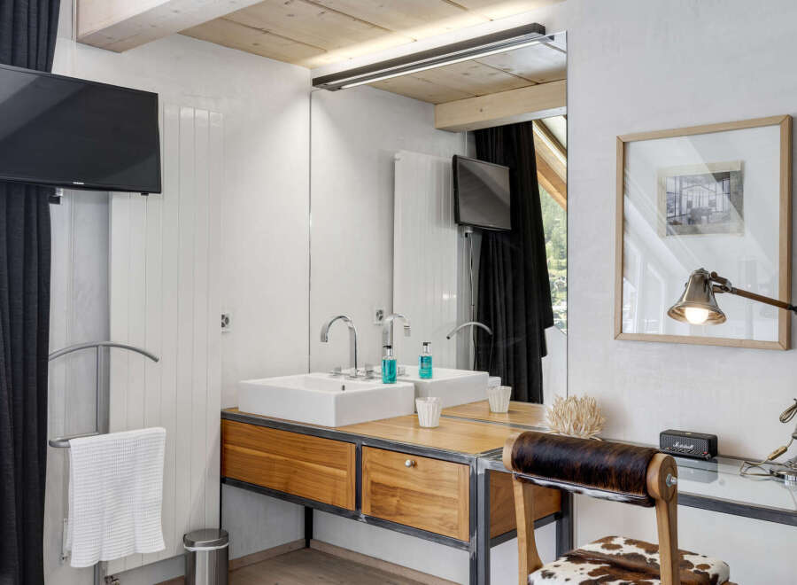 This stunning bathroom features a modern design with a touch of rustic charm.
