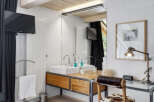 This stunning bathroom features a modern design with a touch of rustic charm.