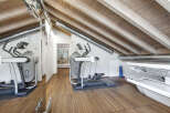 This stunning property boasts a state-of-the-art home gym, perfect for maintaining a healthy lifestyle.