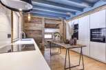 This stunning kitchen showcases a perfect blend of rustic charm and modern elegance.