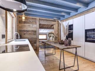 This stunning kitchen showcases a perfect blend of rustic charm and modern elegance.
