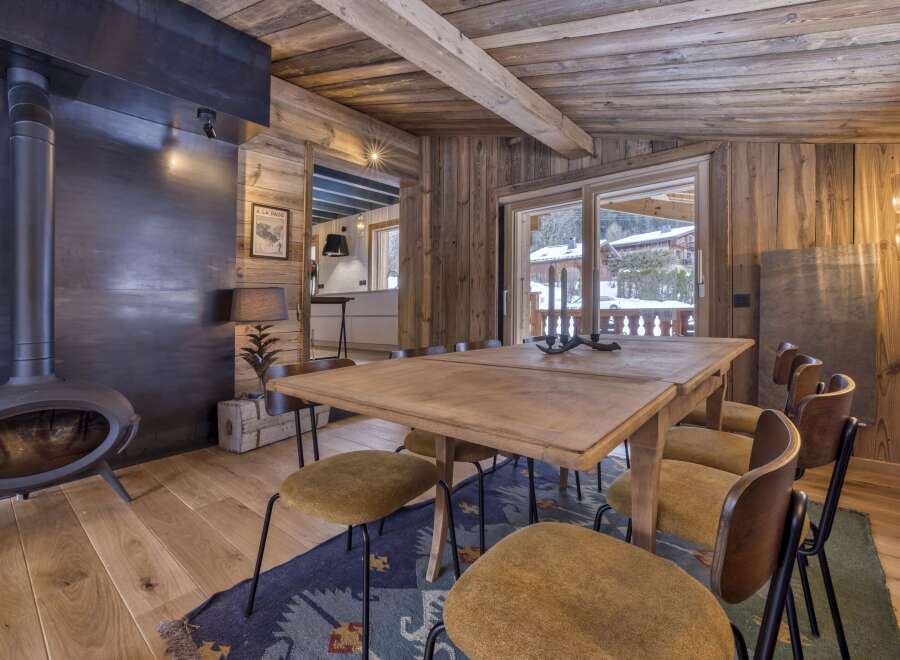 This stunning property boasts a rustic dining area, perfect for cozy gatherings.