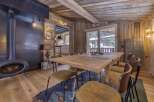 This stunning property boasts a rustic dining area, perfect for cozy gatherings.