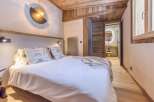 Experience the epitome of rustic elegance in this stunning bedroom.