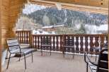 Enjoy breathtaking mountain views from this cozy balcony.