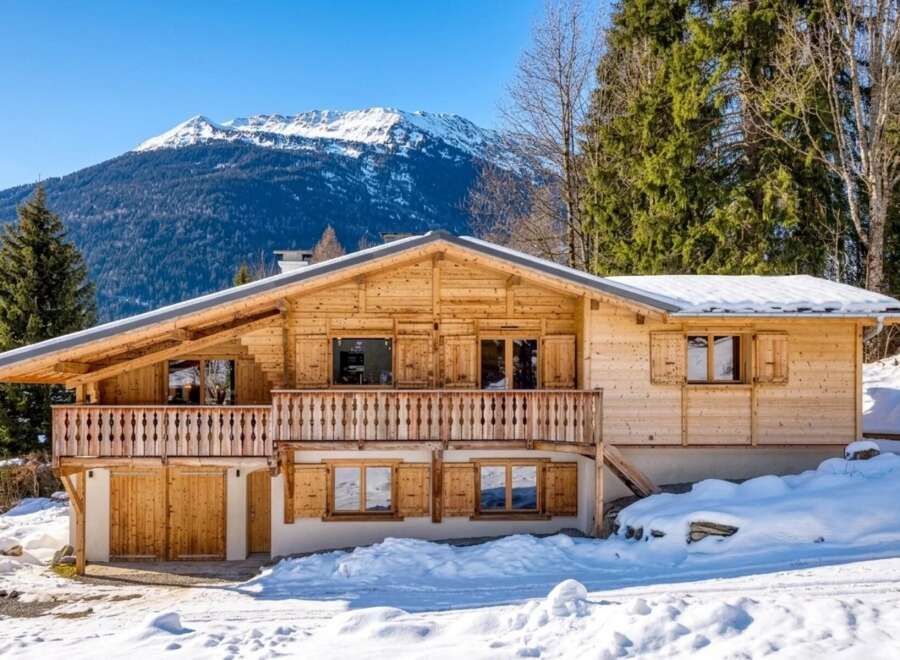 Discover the charm of this stunning wooden chalet nestled in a winter wonderland.
