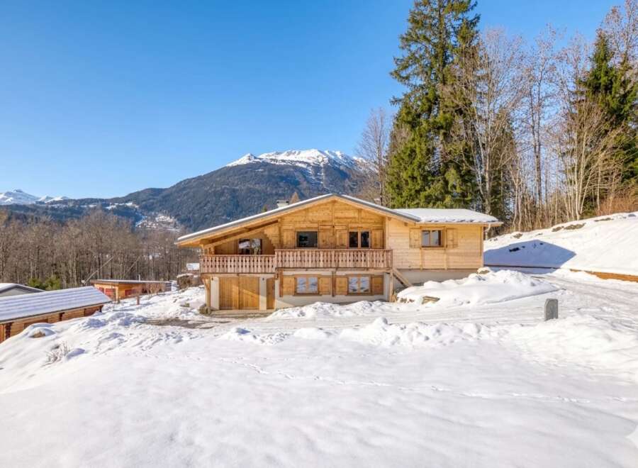 Discover a stunning wooden chalet nestled in a picturesque snowy landscape, offering a perfect blend of rustic charm and modern comfort.
