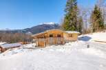 Discover a stunning wooden chalet nestled in a picturesque snowy landscape, offering a perfect blend of rustic charm and modern comfort.