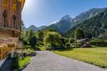 Experience the charm of alpine living in this picturesque property nestled against a backdrop of majestic snow-capped mountains.