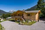 Experience alpine living in this charming wooden chalet, nestled amidst breathtaking mountain scenery.