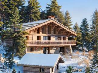 Nestled amidst a snowy landscape, this stunning wooden chalet offers a luxurious retreat.
