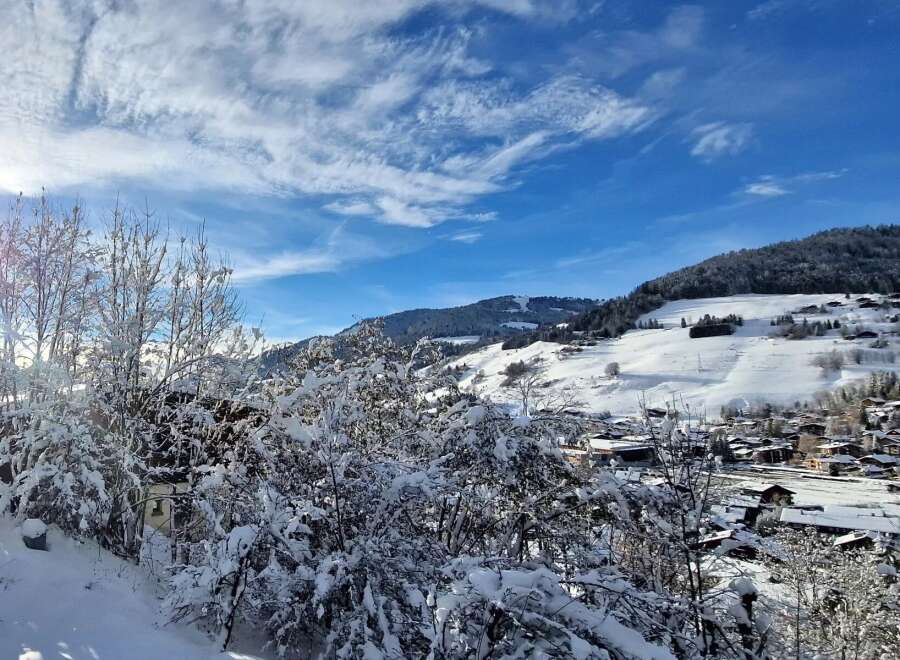Nestled in a picturesque winter wonderland, this property offers stunning views of snow-covered mountains and a charming village.