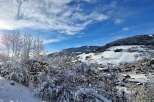 Nestled in a picturesque winter wonderland, this property offers stunning views of snow-covered mountains and a charming village.