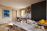 This stunning kitchen boasts a luxurious marble countertop, perfect for preparing meals and entertaining guests.