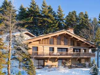 Experience the epitome of luxury living in this stunning wooden chalet nestled amidst a winter wonderland.