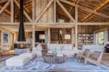 Experience rustic luxury in this stunning property, featuring exposed wooden beams and a cozy fireplace.