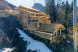 This stunning property under construction showcases a modern architectural design, perfectly blending with its natural surroundings.