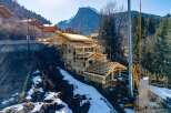 Discover a stunning mountain home under construction, showcasing exceptional craftsmanship and design.
