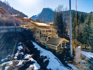 Discover a stunning mountain home under construction, showcasing exceptional craftsmanship and design.