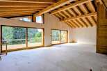 Experience modern living with stunning natural views in this unfinished interior space.