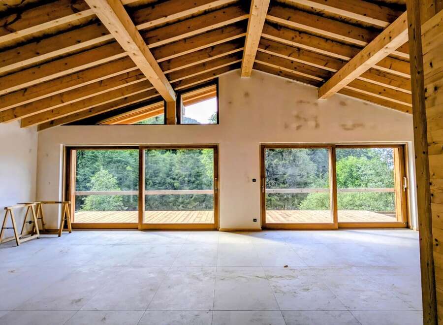 Experience modern living with stunning natural views in this unfinished home.