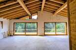 Experience modern living with stunning natural views in this unfinished home.