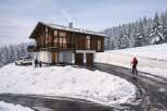 This stunning chalet-style home offers a perfect blend of rustic charm and modern comfort.