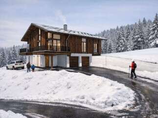 This stunning chalet-style home offers a perfect blend of rustic charm and modern comfort.