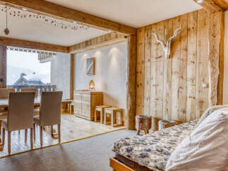 Experience the charm of this stunning property, featuring exquisite wooden accents and a cozy ambiance.