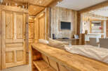 Experience rustic elegance in this stunning property, featuring exquisite wooden paneling and a cozy ambiance.