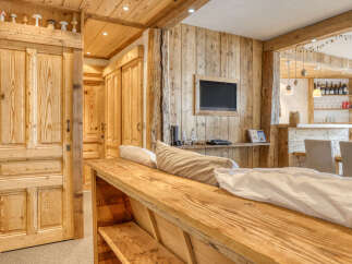 Experience rustic elegance in this stunning property, featuring exquisite wooden paneling and a cozy ambiance.