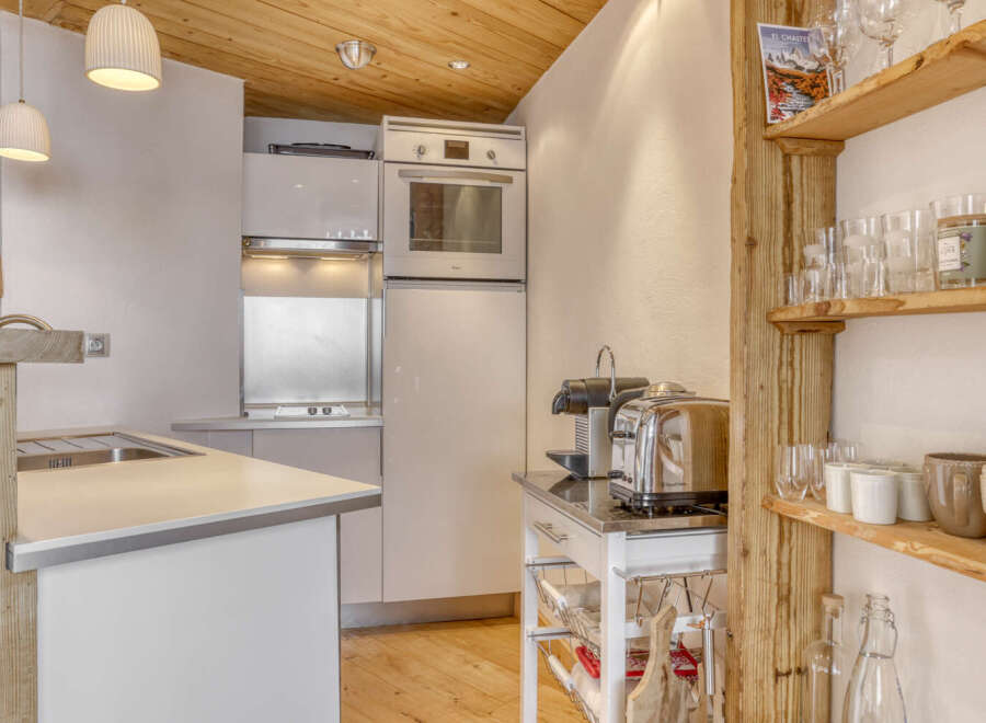 Discover the charm of this modern kitchen, perfect for culinary enthusiasts.