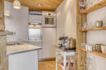 Discover the charm of this modern kitchen, perfect for culinary enthusiasts.