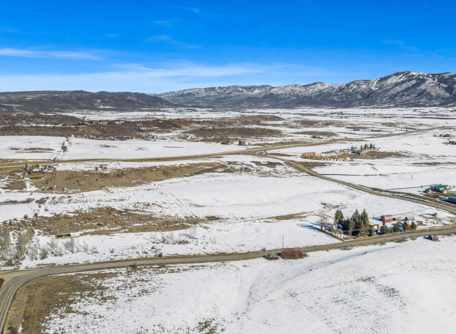 Discover the serene beauty of this expansive property, nestled in a picturesque winter landscape.