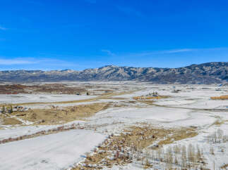 Discover the serene beauty of this stunning property nestled in a picturesque winter landscape.