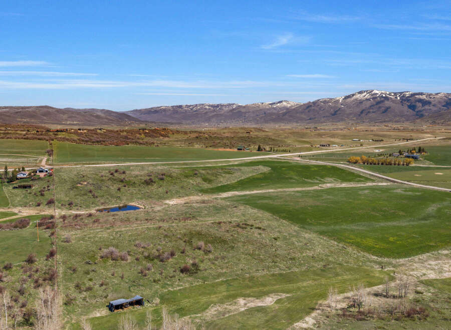 Discover this expansive rural property offering breathtaking mountain views and vast open fields.