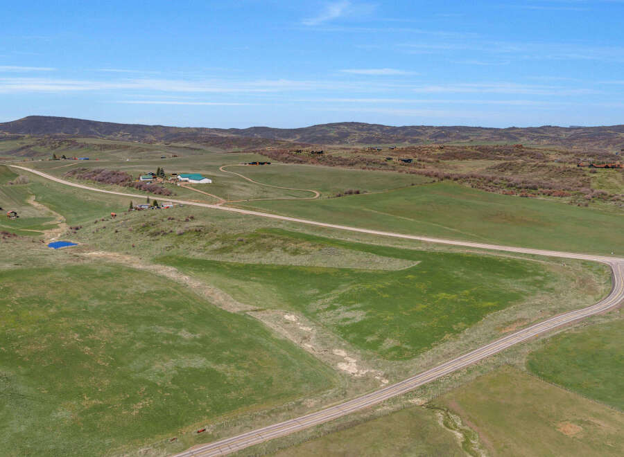 Discover this expansive rural property featuring rolling green pastures, ideal for agricultural pursuits or a private estate.