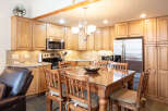 This stunning kitchen features beautiful wooden cabinetry, offering ample storage and a warm, inviting atmosphere.