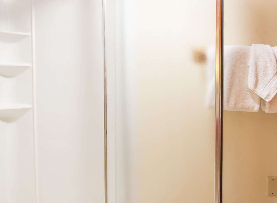 Step into a beautifully designed bathroom featuring a modern shower enclosure.