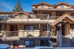 Discover a charming multi-unit property with a rustic exterior and inviting balconies.