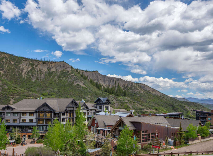 Discover luxury mountain living in this stunning property nestled against a dramatic mountain backdrop.