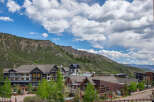 Discover luxury mountain living in this stunning property nestled against a dramatic mountain backdrop.