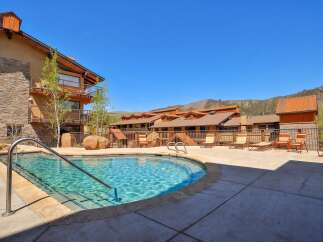 Enjoy a refreshing dip in this stunning outdoor pool, perfect for unwinding after a day of adventure.