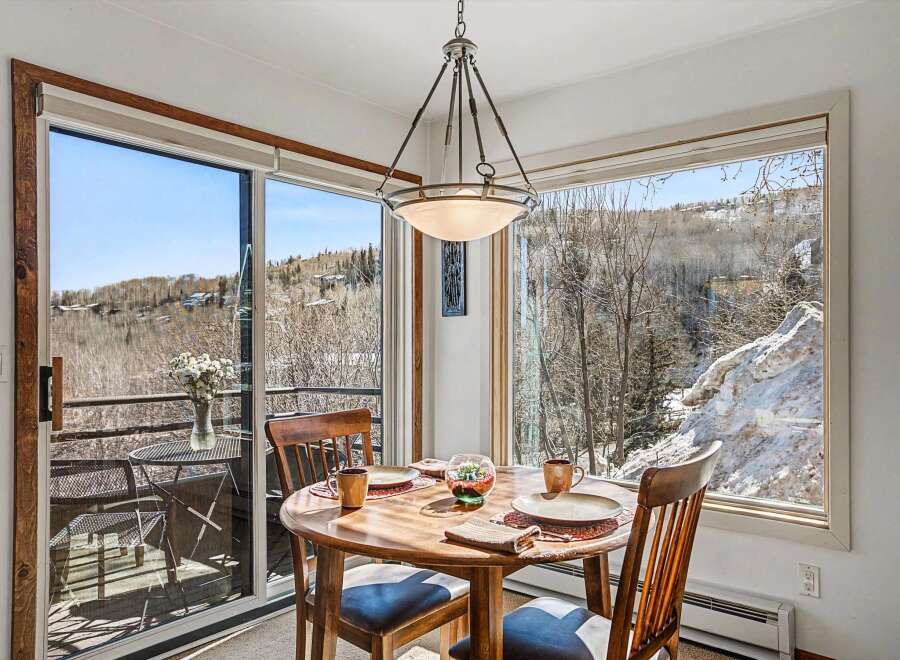 Enjoy breathtaking mountain views from this charming dining area.